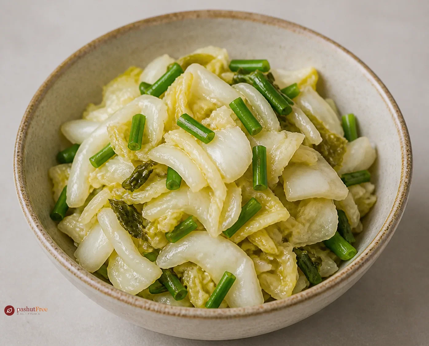 Lao som pak pickled cabbage with green onions in a bowl